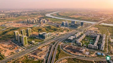 Digital rendering of a modern sustainable greenfield city with rapid transit corridors