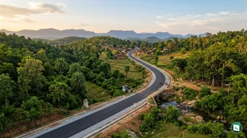 A scenic view of a newly constructed all-weather rural road connecting a remote village.
